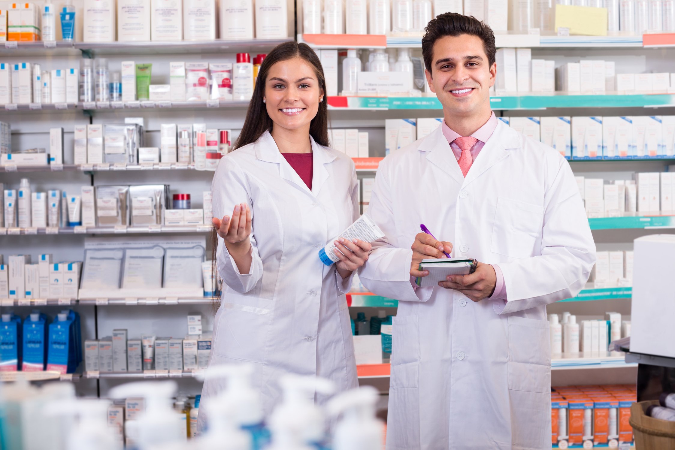 pharmacists posing in drugstore